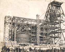Workers lining up to collect their pay in the early 1900s Workers