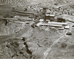 A view of the mine with the scattered town in the rear, ca. 1930s Aerial